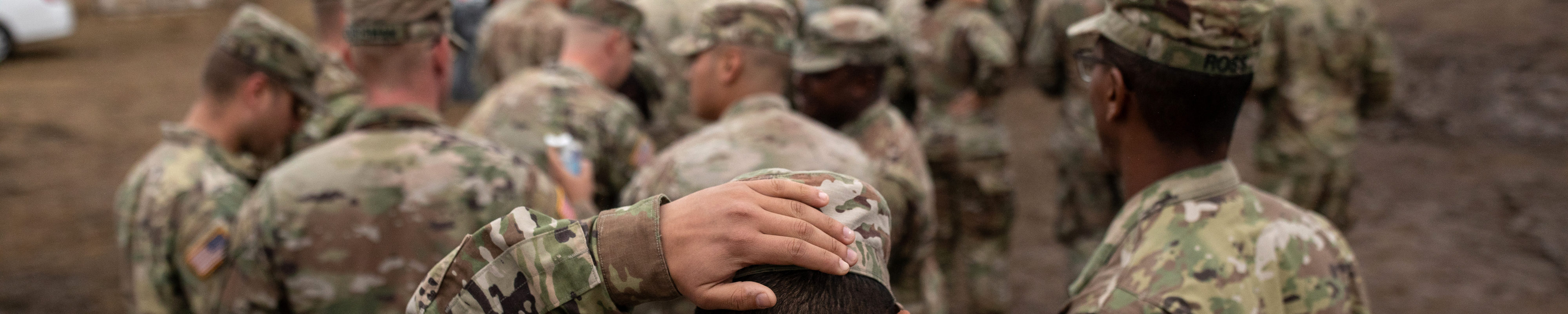 U.S. Army troops deployed to the U.S.-Mexico border line up for a meal at a base near the Donna-Rio Bravo International Bridge on November 22, 2018 in Donna, Texas.