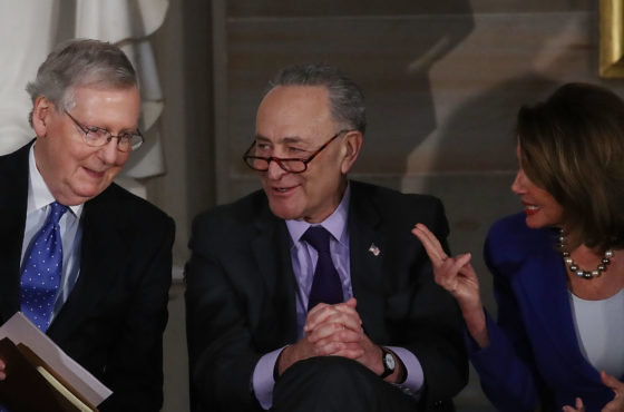 Senate Majority Leader Mitch McConnell (R-KY), Senate Minority Leader Charles Schumer (D-NY) and House Minority Leader Nancy Pelosi (D-CA), confer during a ceremony awarding former Senate Majority Leader Bob Dole the Congressional Gold Medal at the U.S. Capitol on January 17, 2017 in Washington, DC.