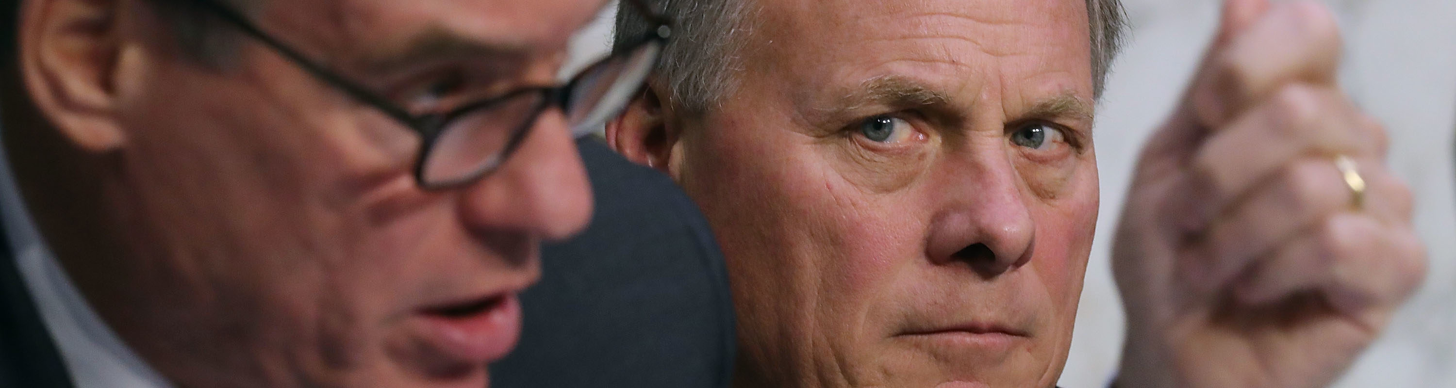 Senate Intelligence Committee Chairman Richard Burr (R-NC) (R) listens to ranking member Sen. Mark Warner (D-VA) question officials from the intelligence community during a hearing in the Hart Senate Office Building on Capitol Hill February 13, 2018 in Washington, DC.