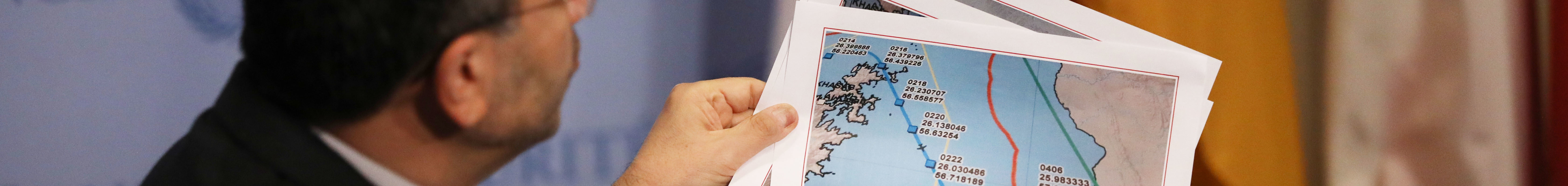 Iran's Ambassador to the United Nations (UN) Majid Takht Ravanchi holds up maps of the Strait of Hormuz while speaking to the media before a meeting with other UN members on the escalating situation with the United States At United Nation headquarters on June 24, 2019 in New York City.