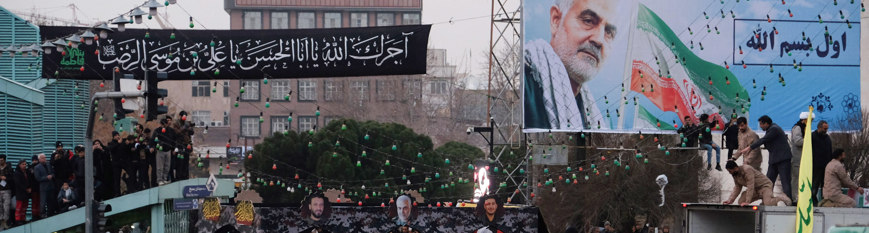 Iranians gather around a vehicle carrying the coffins of slain major general Qassem Soleimani and others, as they pay homage in the northeastern city of Mashhad on January 5, 2020.