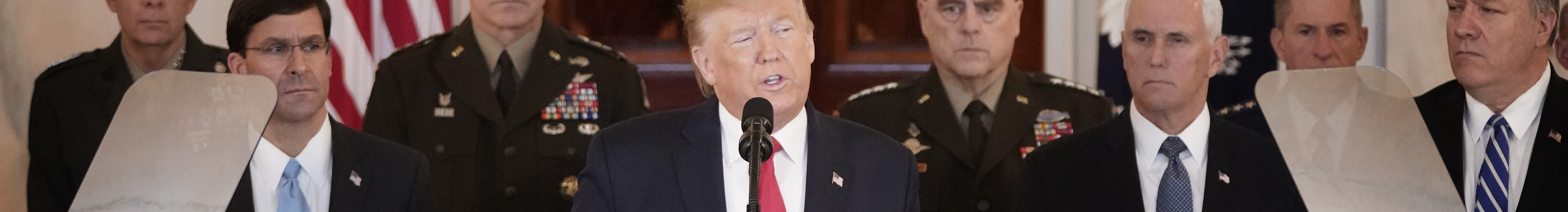 Trump speaks from the White House on January 08, 2020 in Washington, DC. Pence, Pompeo, Esper and others stand around him.
