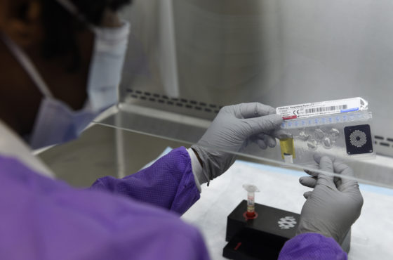 Tech. Sgt. Jonisha Gibson, 82nd Medical Group clinical laboratory noncommissioned officer in charge, inspects a FilmArray pouch.