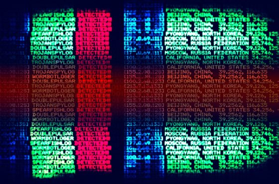 Fictitious malicious coding in a 1970 dot matrix font on a computer screen.