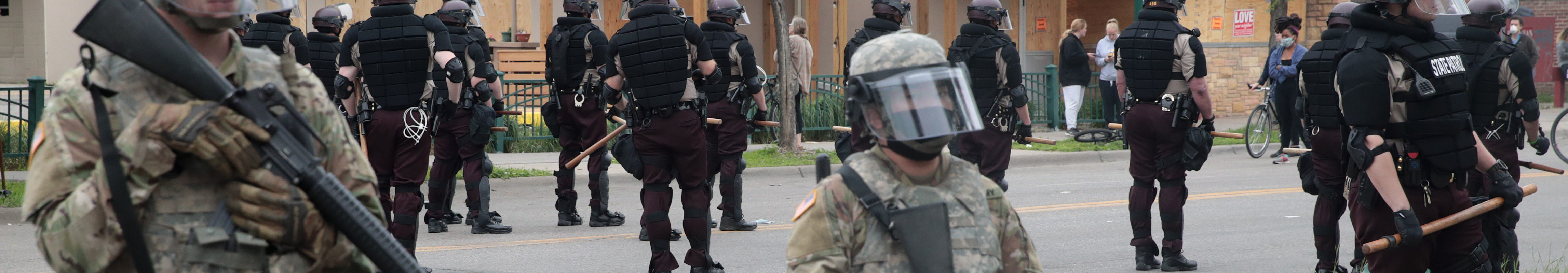Members of the National Guard join police in holding a line on the fourth day of protests on May 29, 2020 in Minneapolis, Minnesota.