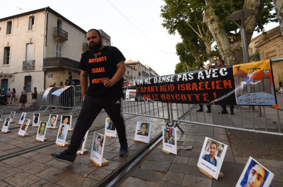 A man attends a protest rally organized by the Boycott, Divestment, Sanctions (BDS) movement on June 28, 2018 in font of Agora in Montpellier, southern France, against the performance of Israeli Batsheva Dance Company at the Montpellier Dance Festival.
