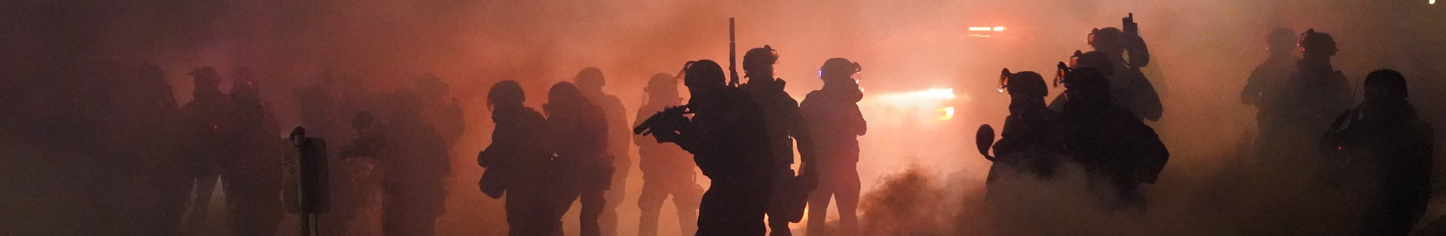 Federal officers deploy tear gas while dispersing a crowd of about a thousand protesters in front of the Mark O. Hatfield U.S. Courthouse on Thursday, July 24, 2020 in Portland, Oregon.