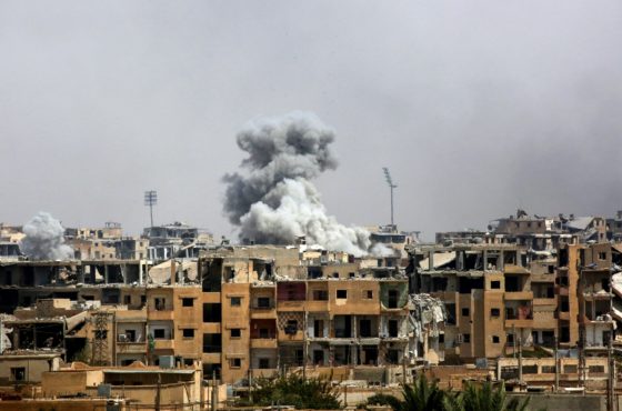 Smoke billowing out of buidlings following a coalition air strike in the western al-Daraiya neighbourhood of the embattled northern Syrian city of Raqa on September 5, 2017.