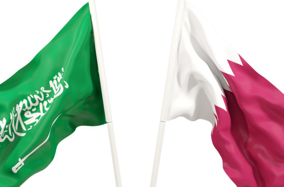 Two waving flags of Saudi Arabia and Qatar.
