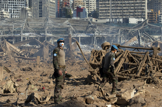 UNIFIL team walks among the destruction from the explosion at Beirut port on Aug 5, 2020.