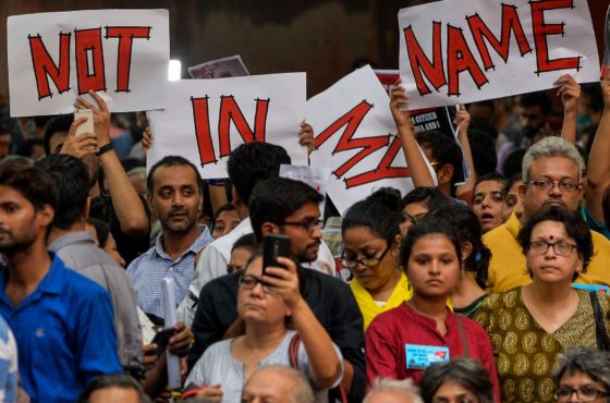 Indian protesters hold placards as they gather during a 'Not in my name' silent protest at Jantar Mantar in New Delhi on June 28, 2017, following a spate anti-Muslim killings.