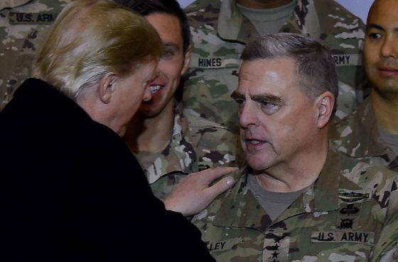 Trump shakes hands with Joint Chiefs Chairman General Mark Milley after addressing the troops at Bagram Air Field during a surprise Thanksgiving day visit, on November 28, 2019 in Afghanistan.
