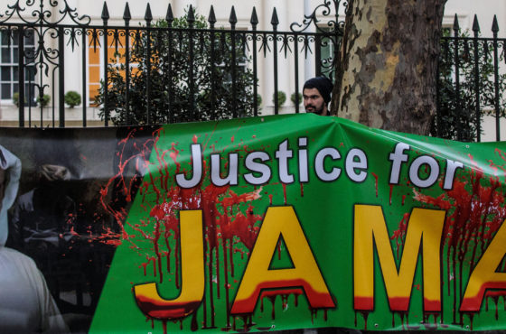 Protesters demonstrate against the war in Yemen and the killing of journalist Jamal Khashoggi outside the Saudi Arabian embassy on October 25, 2018 in London, England. A sign reads, "Justice for Jamal."