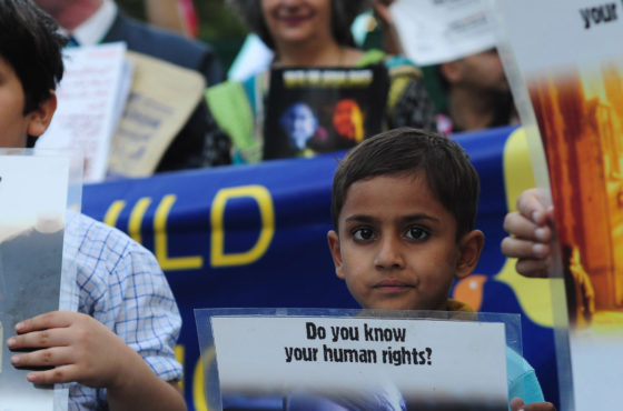 Pakistani children and activists carry placards during a peace walk to mark Human Rights Day in Karachi on December 9, 2012. Signs read, "Do you know your human rights?" and "Human Right #26 The Right to Education"