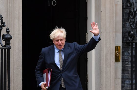 Britain's Prime Minister Boris Johnson waves as he leaves 10 Downing Street in central London on September 9, 2020, to attend Prime Minister's Questions (PMQs) at the House of Commons.