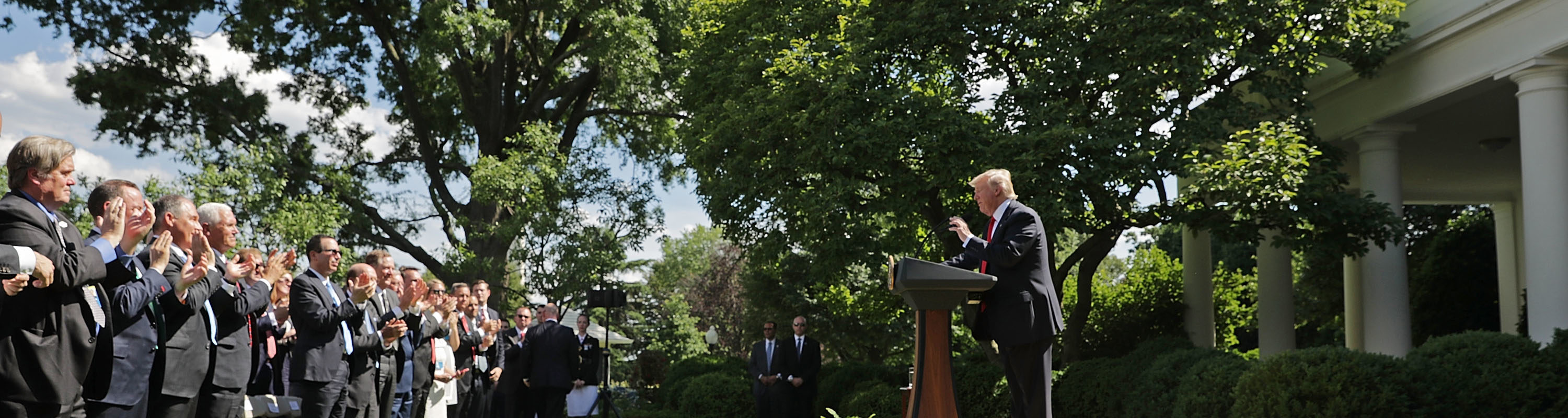 People clap for Trump in the Rose Garden on June 1, 2017 after announcing the US will pull out of the Paris climate agreement.