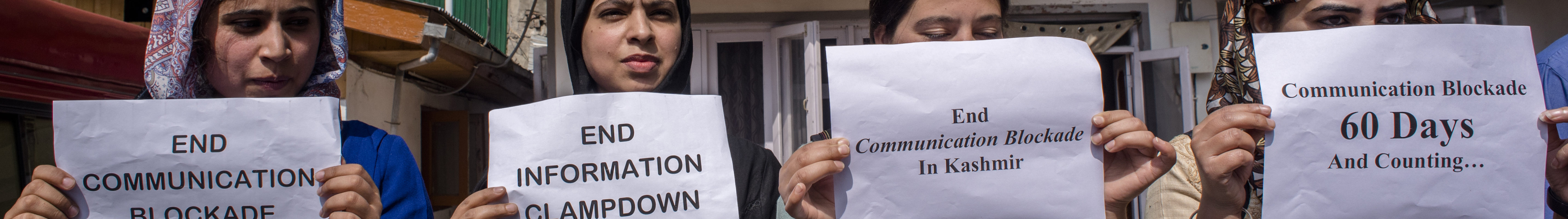Kashmiri women journalists hold placards as they protest against the continued communication blockade by the Indian authorities after the revocation of special status of Kashmir on October 3, 2019 in Srinagar, the summer capital of Indian administered Kashmir, India. Signs read, “End communication blockade,” “End information clampdown,” “End communication blockade in Kashmir,” and “Communication blockade 60 days and counting…”