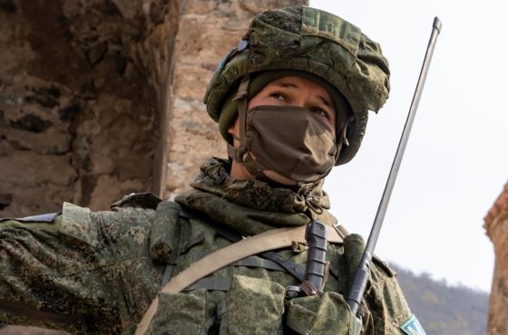 A Russian peacekeeper gestures in the yard of the 12th-13th century Orthodox Dadivank Monastery on November 16, 2020, after the monastery was put under Russia's protection as part of the peace agreement between Armenia and Azerbaijan over the breakaway region of Nagorno-Karabakh.