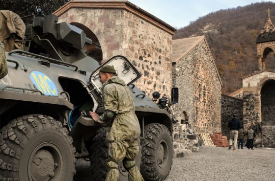 Russian troops check their equipment in their Armoured Personnel carrier (APC) stationed in front of the 12th-13th century Orthodox Dadivank Monastery, outside the town of Kalbajar on November 15, 2020, after the monastery was put under their protection during the military conflict between Armenia and Azerbaijan over the breakaway region of Nagorno-Karabakh.
