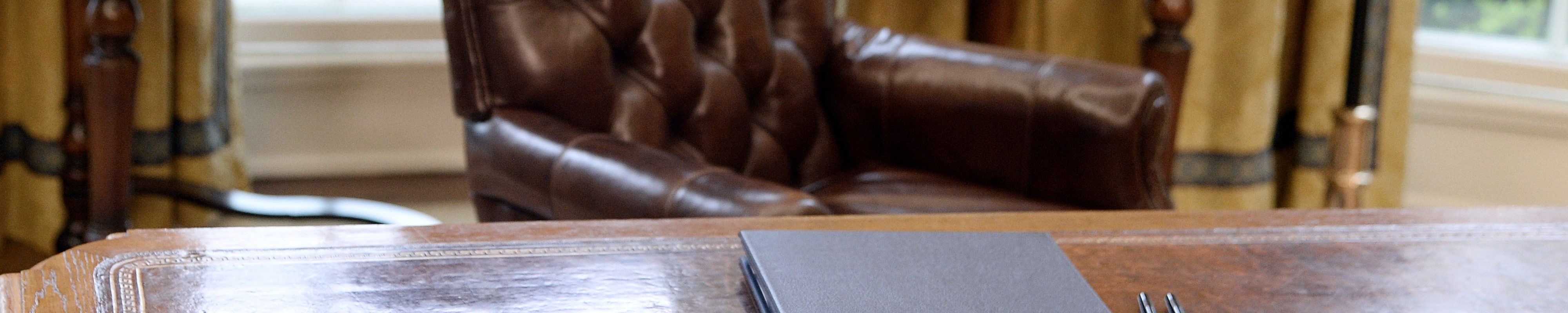 Executive Orders regarding trade lay on the Resolute desk in the Oval Office of the White House March 31, 2017 in Washington, DC.