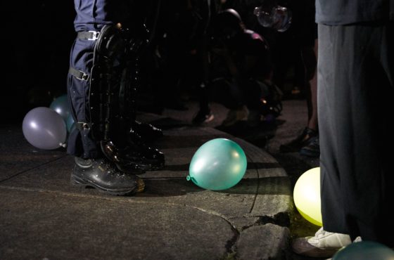 An Oregon State police officer stands next to a balloon outside the Police Union building in Portland, Oregon, on September 4, 2020.