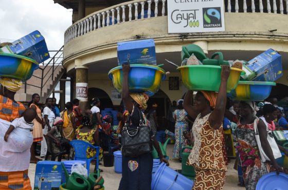 Cocoa producers of the Yakasse-Attobrou Agricultural Cooperative (Cooperative Agricole de Yakasse-Attobrou - CAYAT) carry agriculture kits distributed by the cooperative at the CAYAT headquarters in Adzope on Agust 31, 2018.