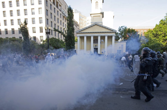 Police shoot tear gas at demonstrators protesting police brutality and the murder of George Floyd. Protestors run in a panic to escape the tear gas outside St. John's Episcopal Church outside the White House. The police wear full riot gear including helmets, face shields, body shields, batons and masks. June 1, 2020 Washington DC