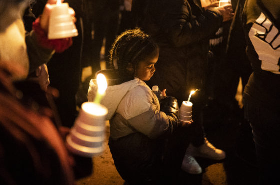 Jarraye Moore, age 5, listens to speakers at a candle light vigil for his second cousin, Kevin Peterson Jr., on December 6, 2020 in Vancouver, Washington. Clark County Sheriffs deputies shot and killed Peterson in October, sparking Black Lives Matter vigils and counter protests by far-right groups.