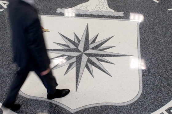 A man crosses the Central Intelligence Agency (CIA) seal in the lobby of CIA Headquarters in Langley, Virginia, on August 14, 2008.