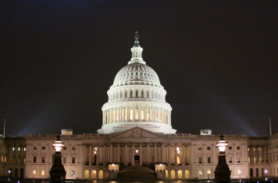 The US Capitol Building is lit up at night.