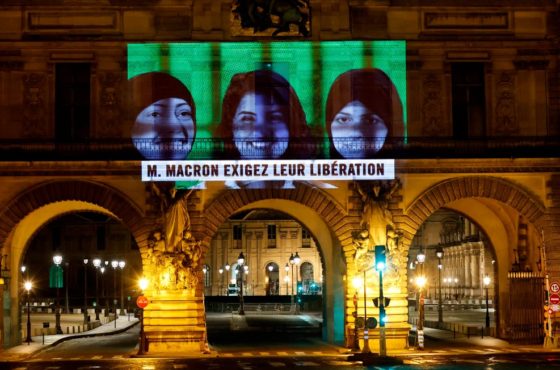 A projection on the Louvre Museum in Paris by Amnesty International members depicting jailed Saudi human rights activists including Loujain Al-Athloul and reading "Mr Macron, demand their release", ahead of the upcoming virtual G20 summit. November 19, 2020
