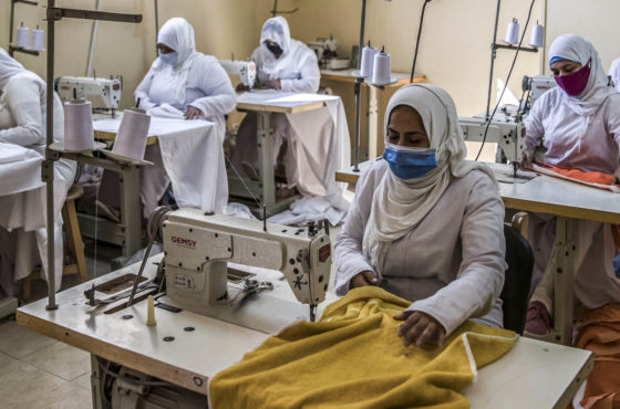 This picture taken during a government-guided tour on December 27, 2020 shows inmates operating sewing machines at a workshop at al-Qanatir women's prison, at the tip of the Nile delta in Qalyoubiya province, about 30 kilometres north of Egypt's capital. The wear face masks and appear to be socially distanced.