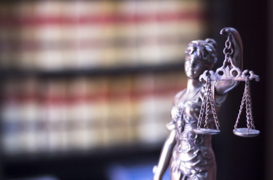 Legal blind justice Themis metal statue with scales on chains