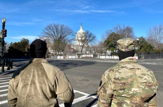 US National Guard soldiers guard the grounds of the US Capitol from across a security fence in Washington, DC, on January 9, 2021.