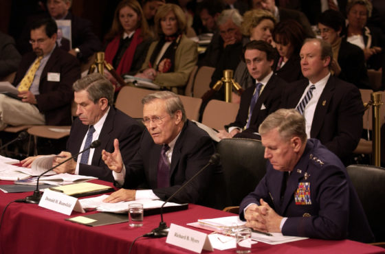Secretary of Defense Donald H. Rumsfeld gives his opening remarks before the 9-11 Commission on March 23, 2004. He sits next to two others testifying.
