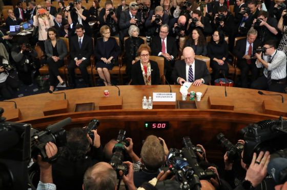 Former U.S. Ambassador to Ukraine Marie Yovanovitch arrives to testify before the House Intelligence Committee in the Longworth House Office Building on Capitol Hill November 15, 2019 in Washington, DC. Photographers crowd in front of the bench she sits at and take photos. The chairs behind her appear crowded and full.