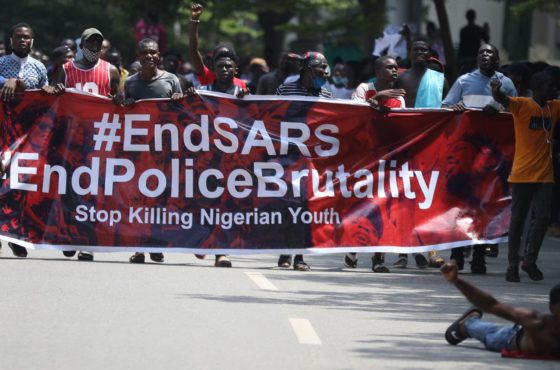 Protesters carry a banner during a demonstration to press for the scrapping of Special Ant-Robbery Squad (SARS) on Abuja-Keffi Expressway, Abuja, Nigeria on October 19, 2020. The banner reads, “#EndSARA #EndPoliceBrutality Stop Killing Nigerian Youth”
