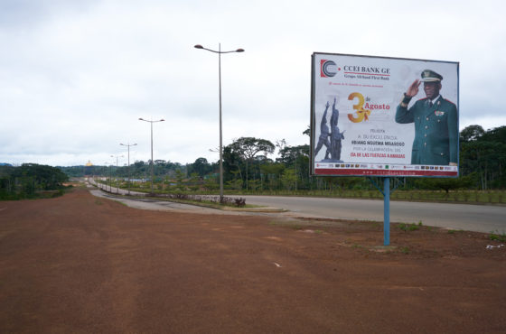 A billboard with president Teodoro Obiang Nguema Mbasogo stands over the empty streets of the new capital city on August 16, 2018 in Oyala, Equatorial Guinea. The dome at the end of the street will be the new house for the president.