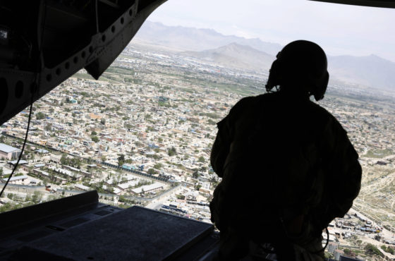 A U.S. soldier mans a gun at the back gate aboard the helicopter carrying U.S. Defense Secretary James Mattis as he arrives via helicopter at Resolute Support headquarters on April 24, 2017 in in Kabul, Afghanistan.