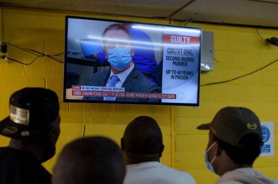 People gather inside the Twees Foods Store in the Third Ward where George Floyd grew up in Houston, Texas, to watch on TV the verdict in Derek Chauvin's trial on April 20, 2021. -