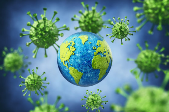 A digital stylization of the globe surrounded by balls of coronavirus.